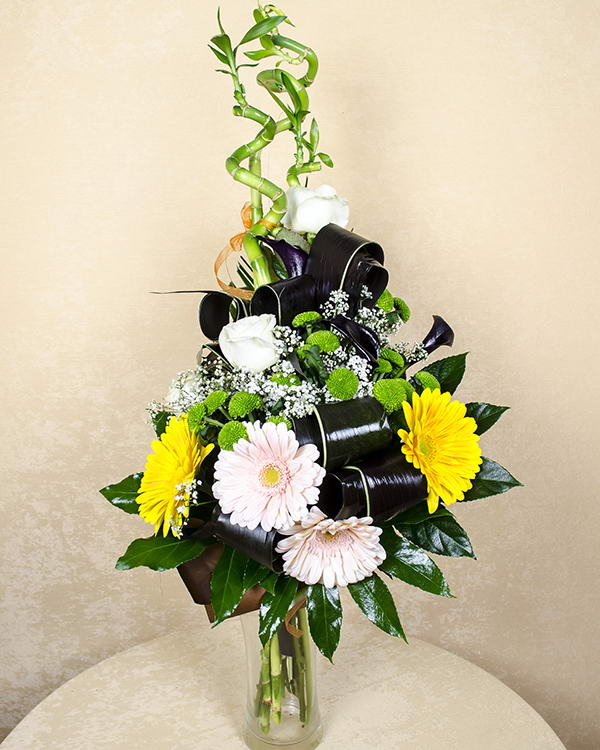 Bouquet with gerbera, roses and bamboo