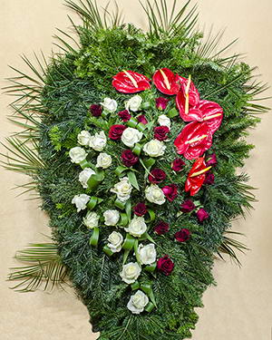 Funeral wreath with red, white roses and Anthurium