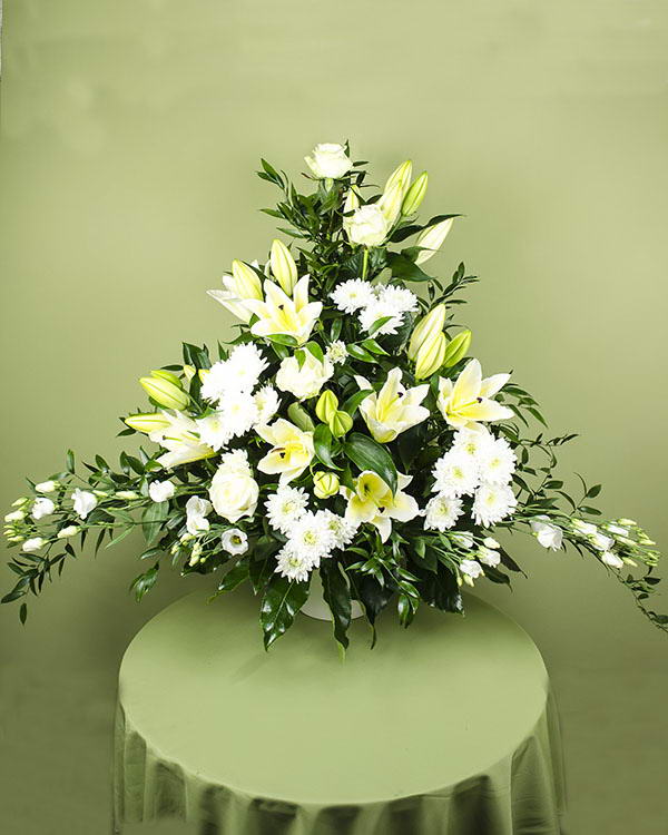Elegant funeral arrangement with white flowers