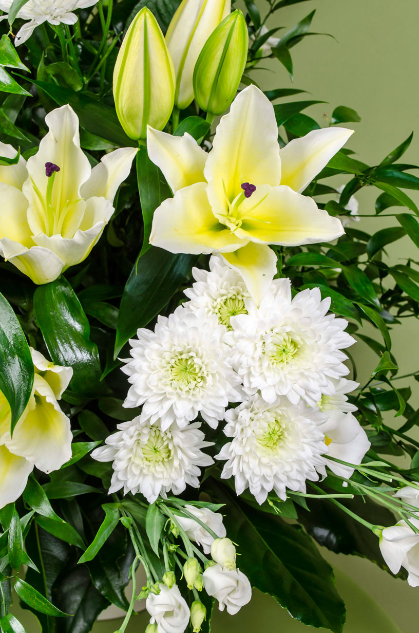 Elegant funeral arrangement with white flowers
