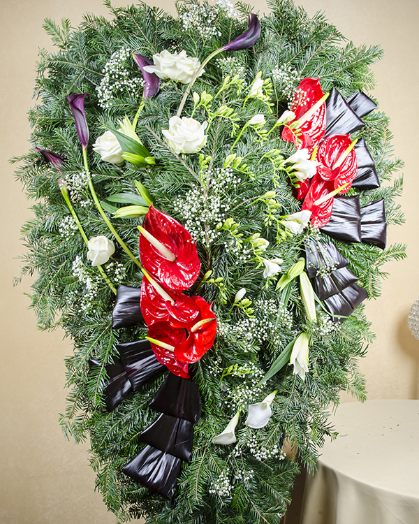 Funeral wreath with roses, freesias, lilies, callas and anthurium