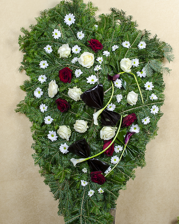 Funeral wreath with natural flowers and accessories