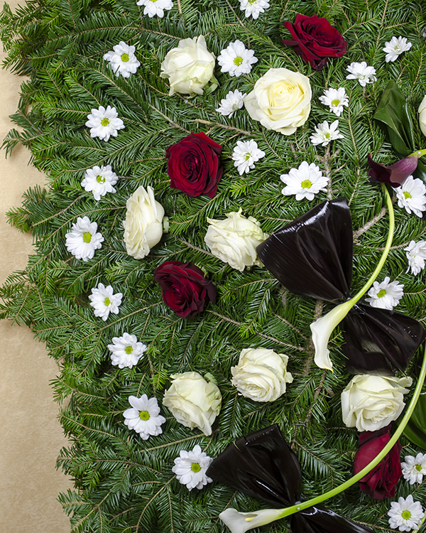 Funeral wreath with natural flowers and accessories
