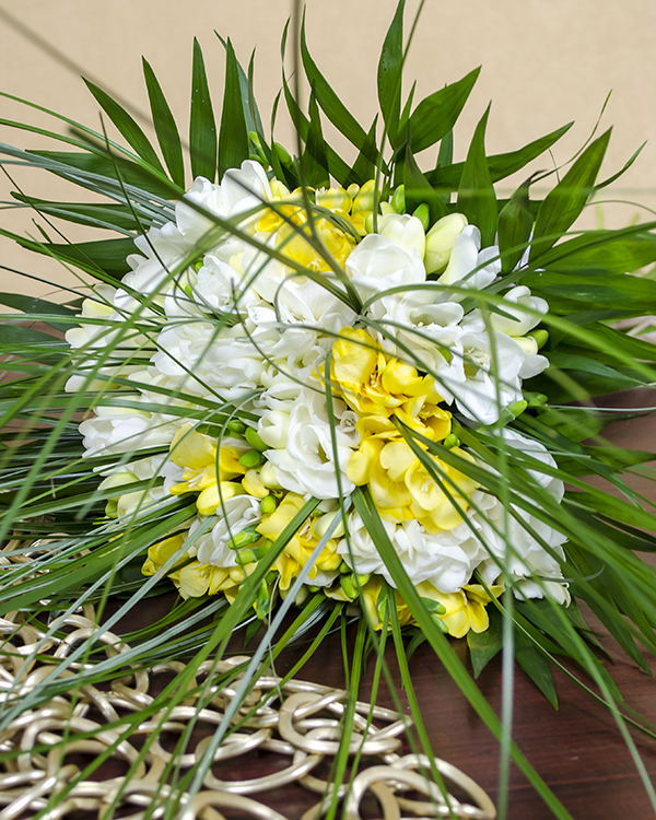 Fresh spring bouquet made of white and yellow freesias