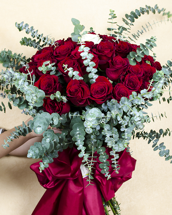 60 red roses and 1 white rose bouquet