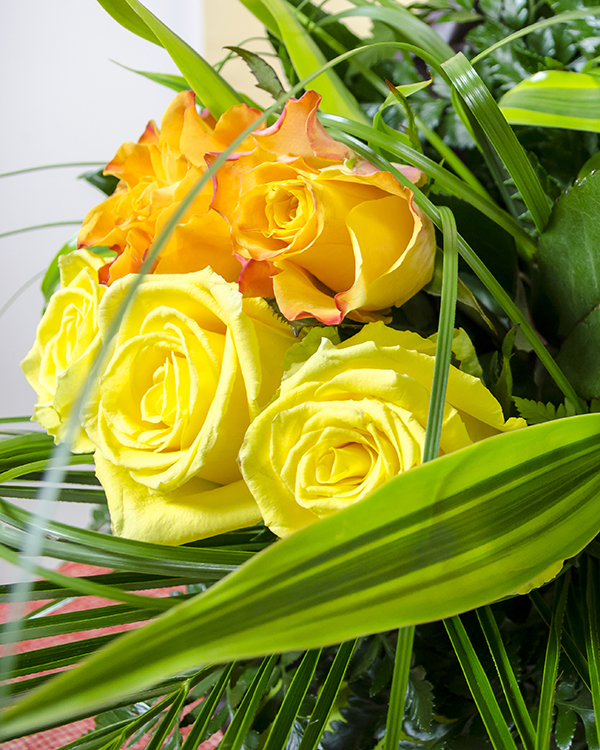 Bouquet with yellow roses and floral accessories