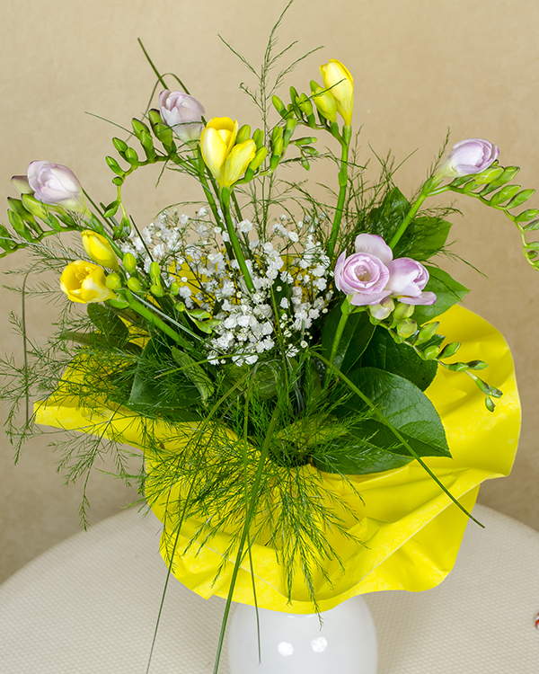 Bouquet of fresias and assorted greenery