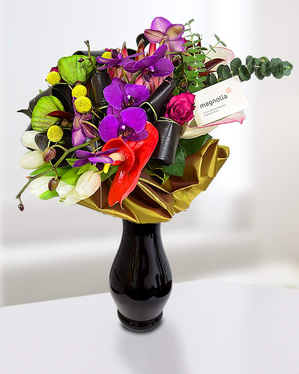 Exotic bouquet with orchid, craspedia and protea