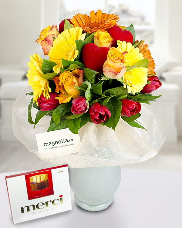Bouquet of roses gerberas tulips and chocolate