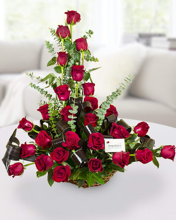 Arrangement with 27 red roses in a basket