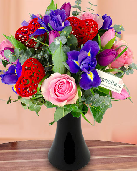 Bouquet of irises, roses and tulips