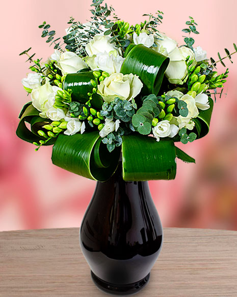 Bouquet with white roses, white freesias, eucalyptus and Cordyline