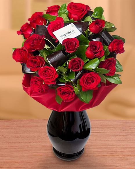 Red roses bouquet with cordyline