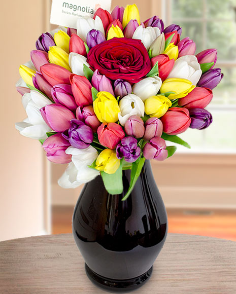 Bouquet with mixed tulips and one rose