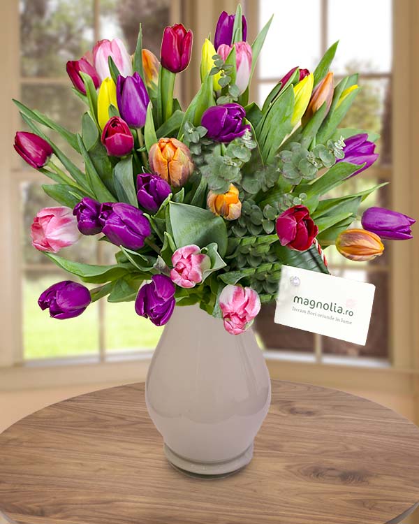 Colored tulips bouquet with eucalyptus and aspidistra