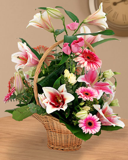 Basket arrangement with white and pink flowers