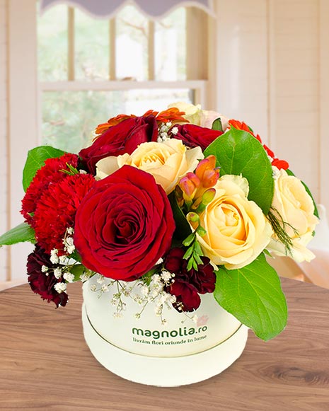 Arrangement in box with mix red and yellow flowers