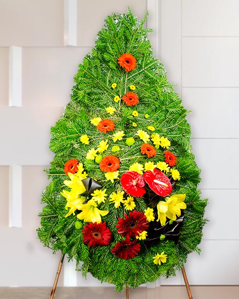 Funeral wreath with red and yellow flowers