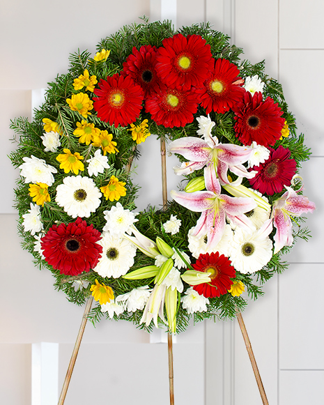 Funeral sheaf with lilies and red gerbera