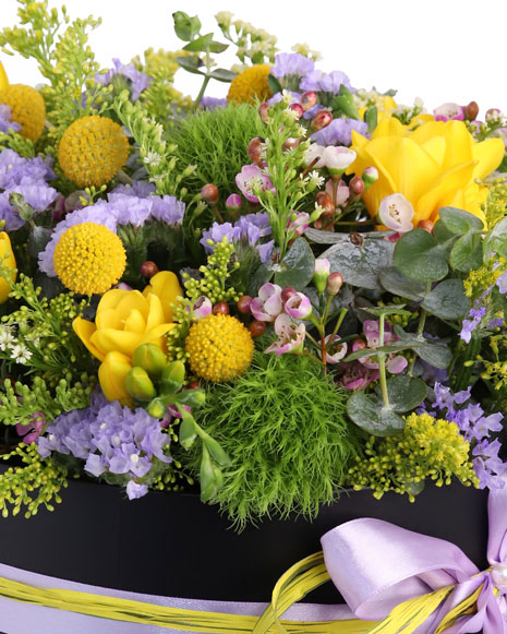 Box with purple and yellow flowers