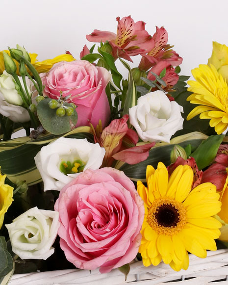 Basket with yellow and pink roses