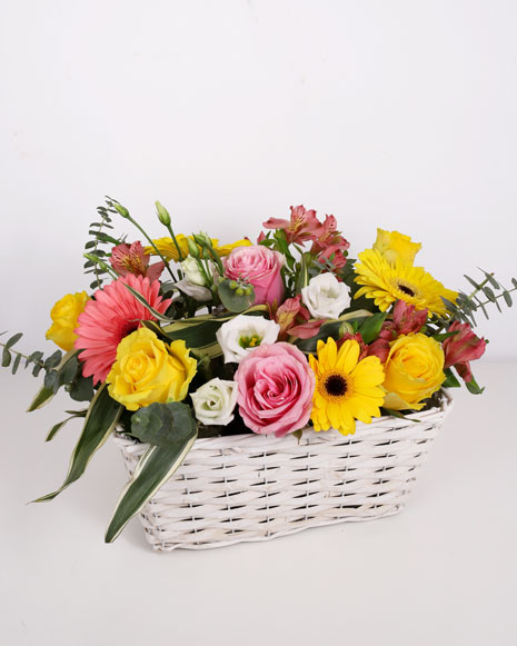 Basket with yellow and pink roses