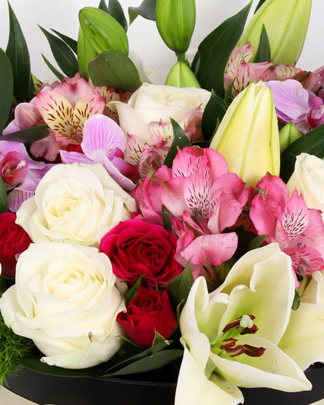 Box with pink and white flowers