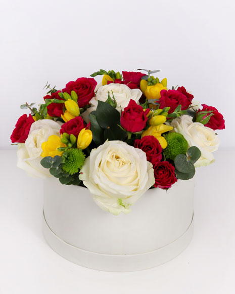 Box with white roses and freesias