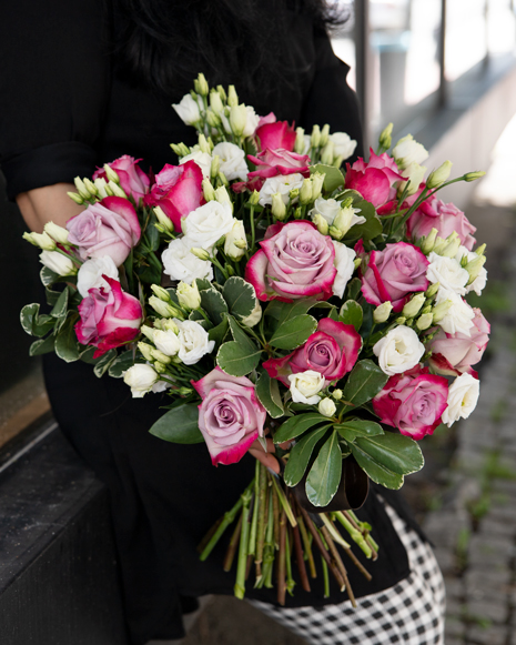 Bouquet with purple roses and eustoma