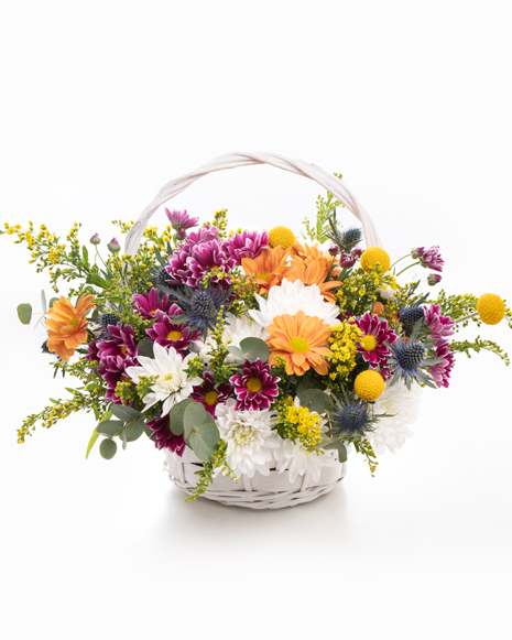 Basket with chrysanthemums and solidago