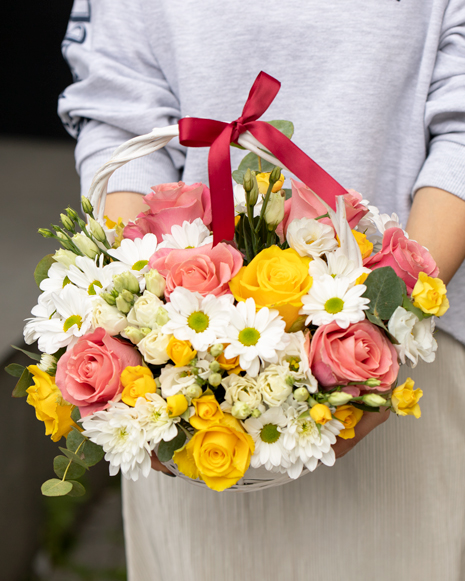 Basket with chrysanthemums and roses