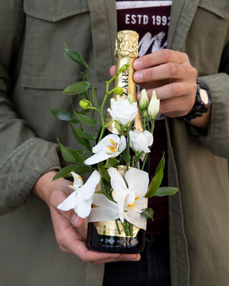 Arrangement with sparkling wine and Phalaenopsis 