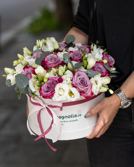 Box with purple roses and freesias