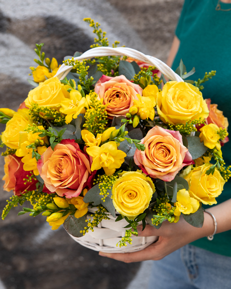 Freesias and roses basket arrangement
