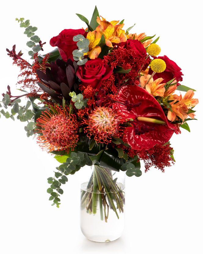 Bouquet with red roses and exotic flowers