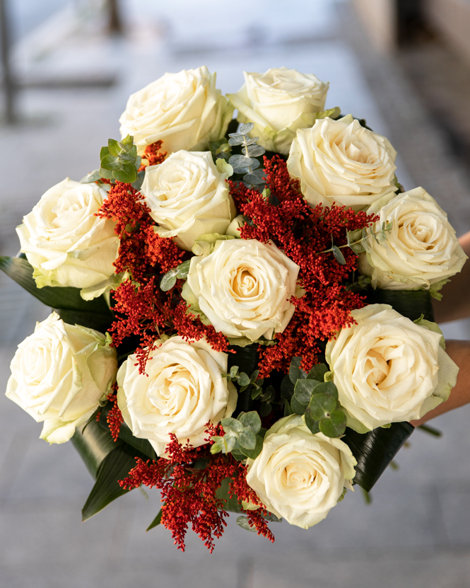 Bouquet with white roses and solidago