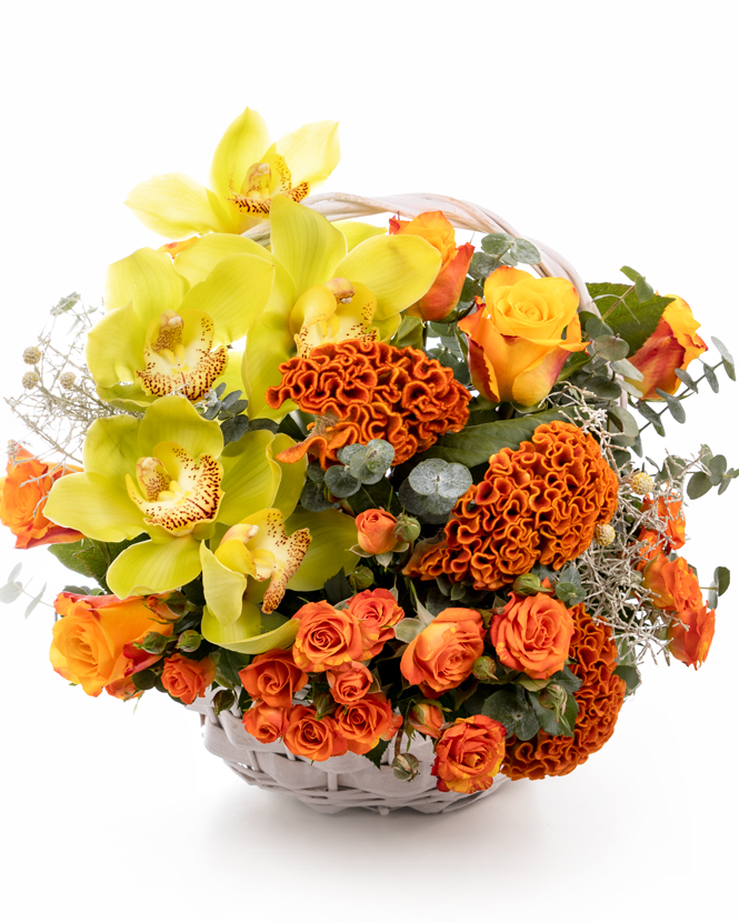 Basket with orange roses and orchid