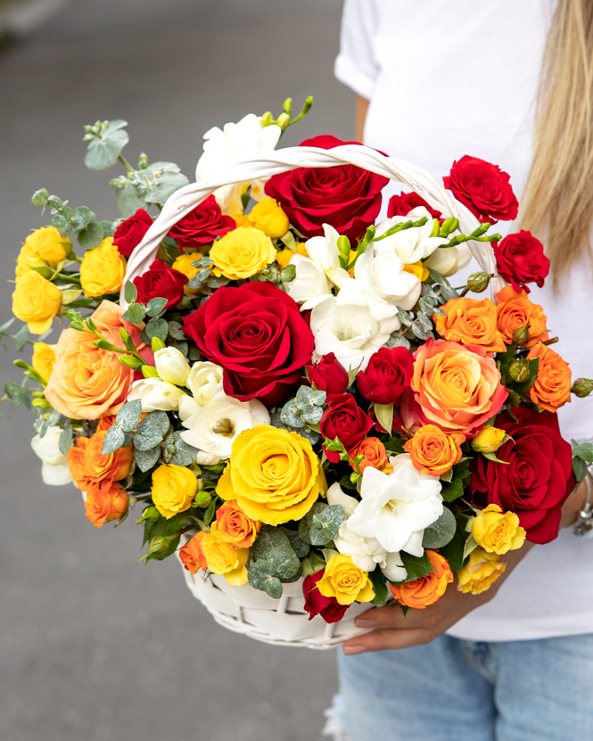 Basket with multicolored roses