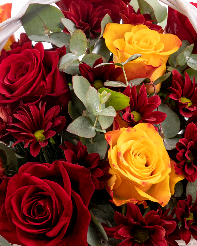 Basket with chrysanthemums and roses