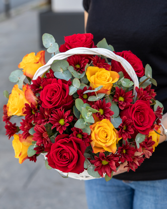 Basket with chrysanthemums and roses