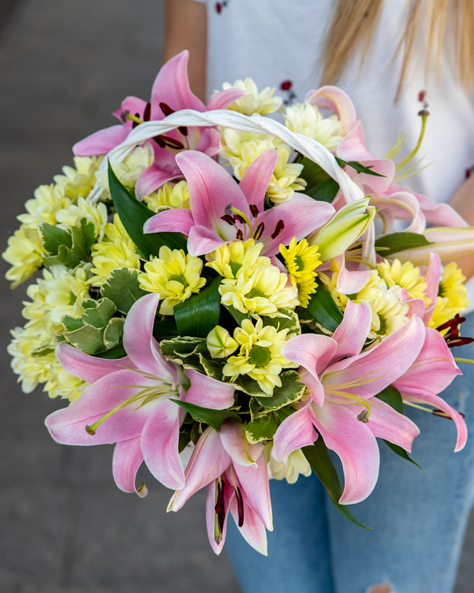 Basket arrangement with lilies