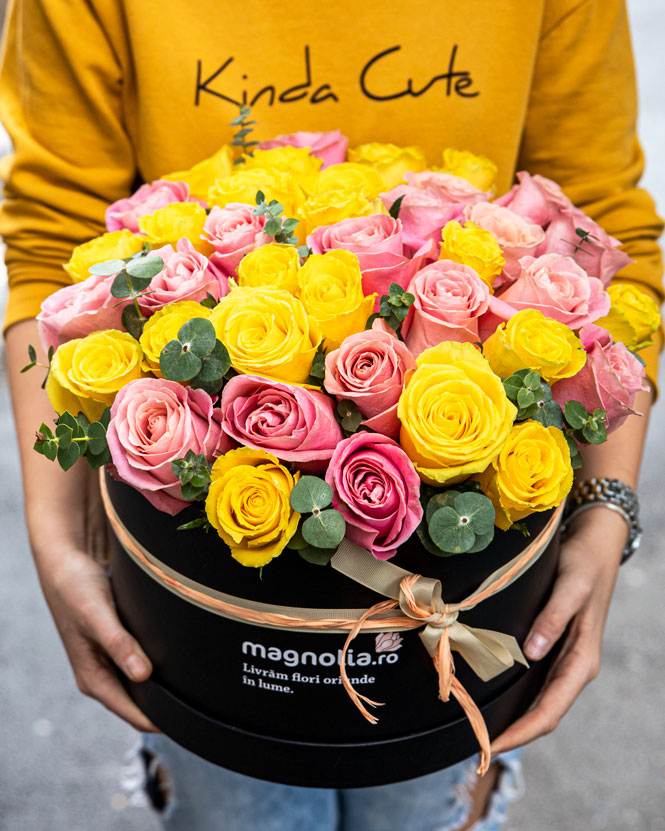 Box arrangement of pink and yellow roses