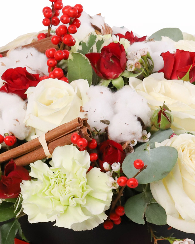 Box with roses and winter accesories
