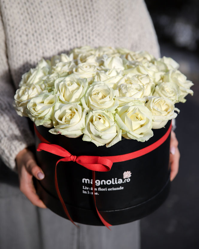 Box with white roses