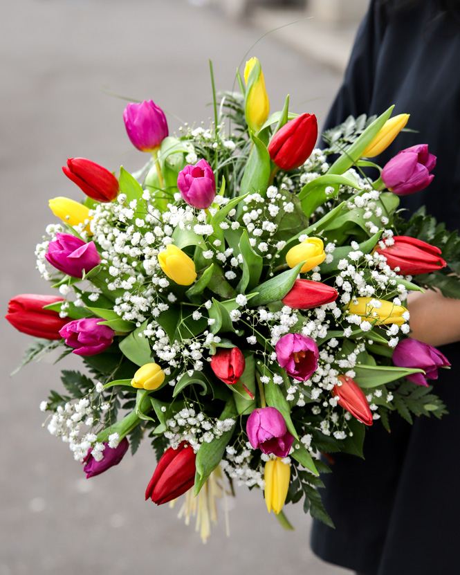 Bouquet with colorful tulips and gypsophila