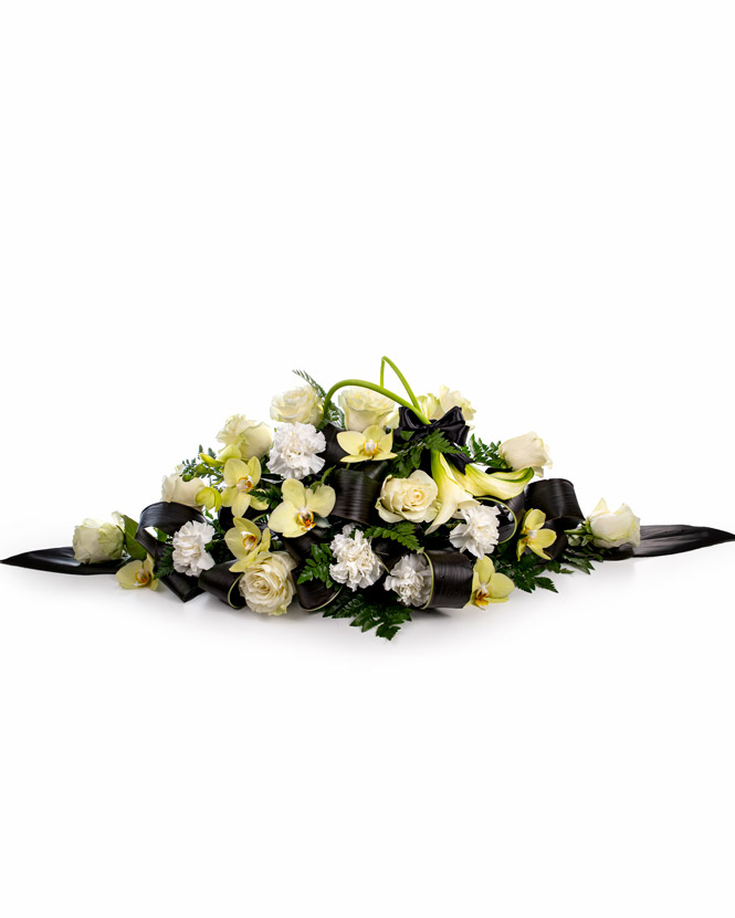 Funeral arrangement with orchids and calla lilies