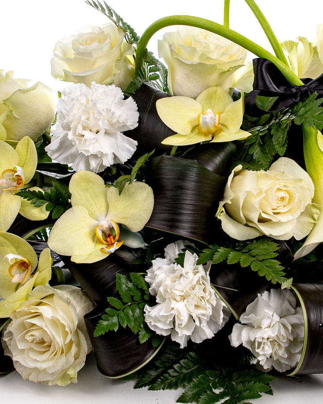 Funeral arrangement with orchids and calla lilies