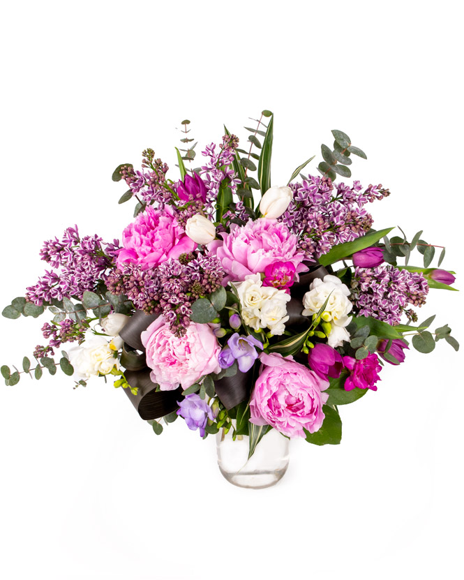 Delicate bouquet with peonies and lilacs
