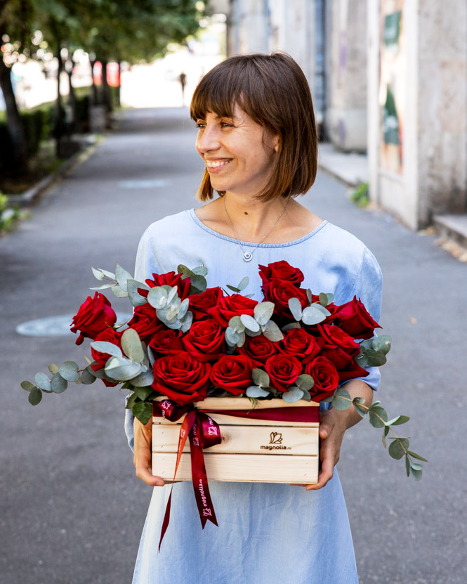 Wooden box with red roses