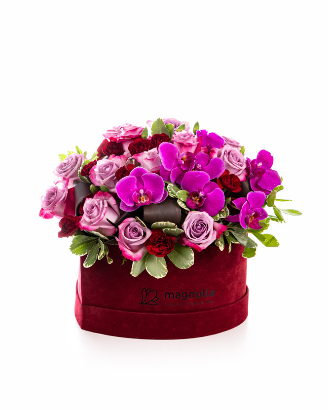 Orchids and roses in heart box